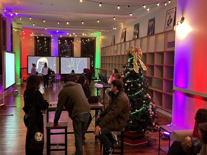 A group of people programming lights and animations.